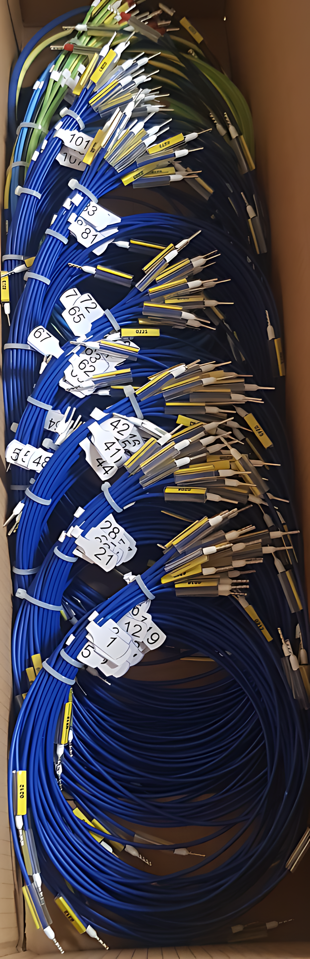Cut and labelled wires with ferrules, sorted into a wire kit